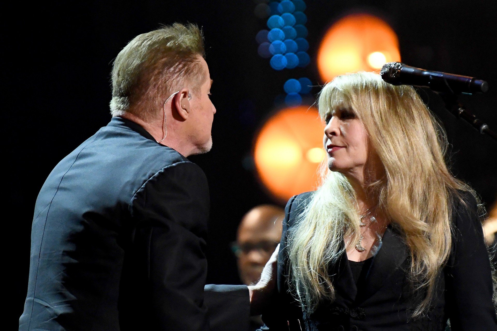 Stevie Nicks and Don Henley face each ohter