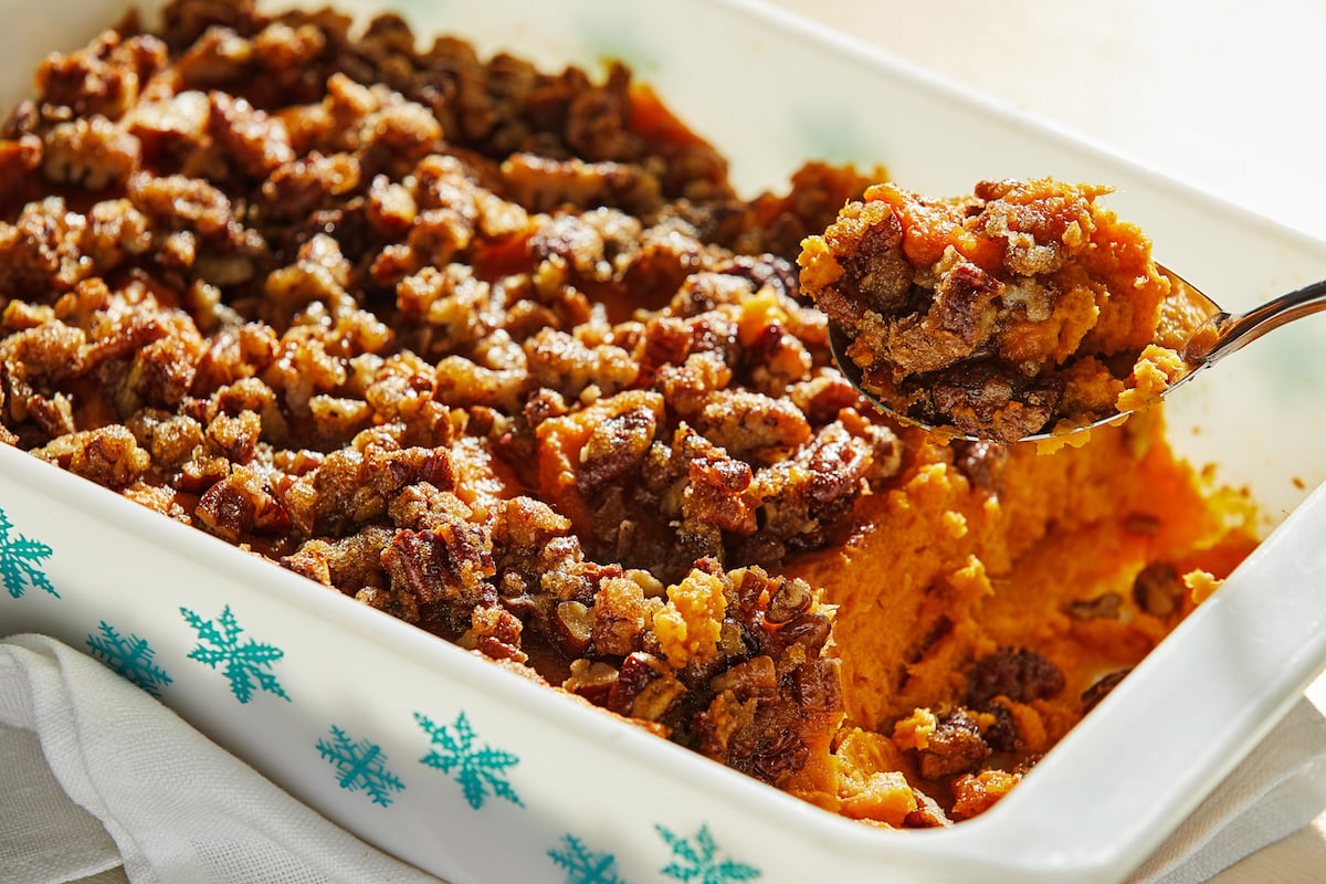 Sweet potato casserole with a crumb topping in a Pyrex dish