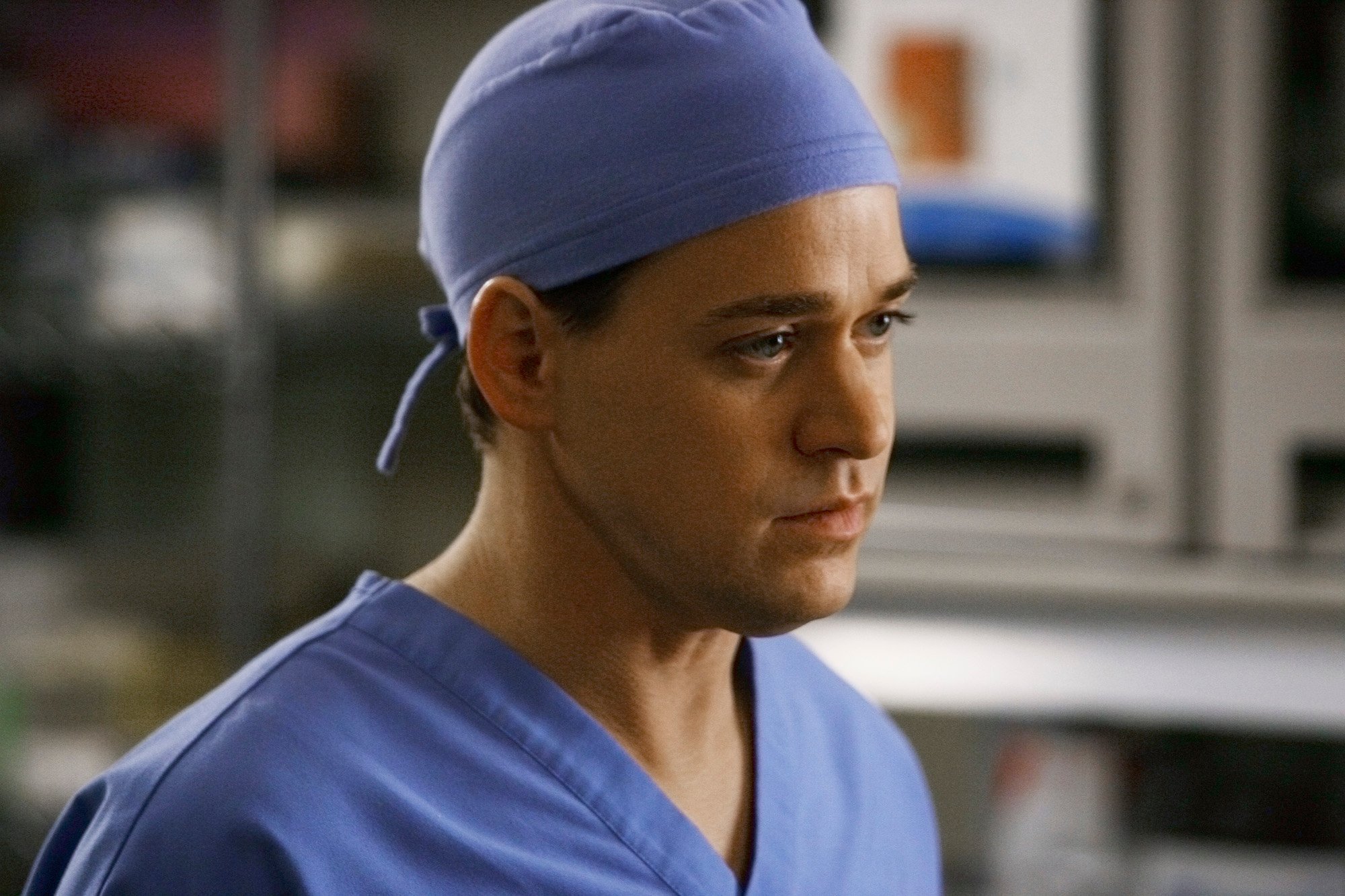 T.R. Knight wearing blue scrubs in 'Grey's Anatomy.'