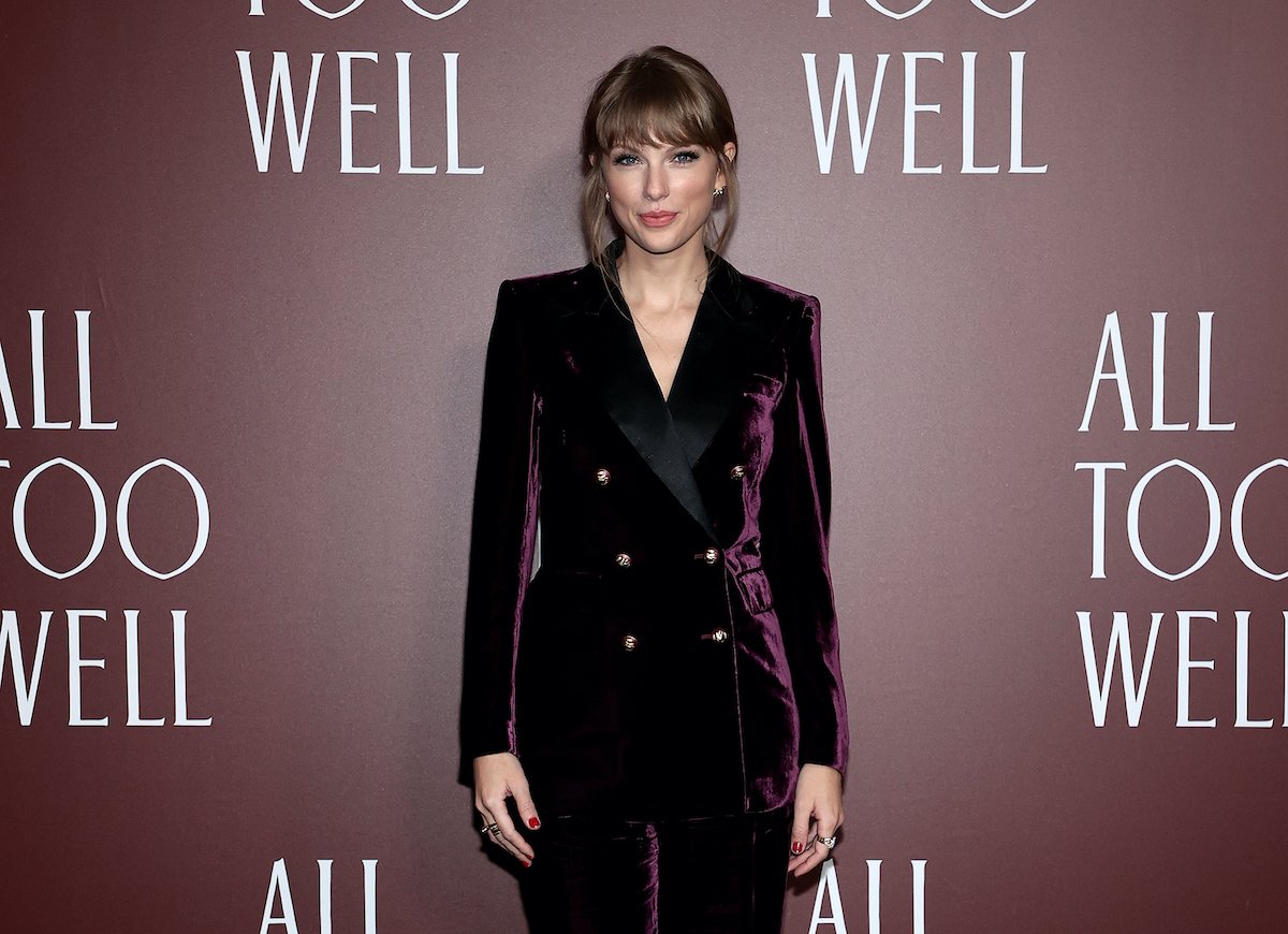 Taylor Swift attend the All Too Well premiere in New York wearing a burgundy suit