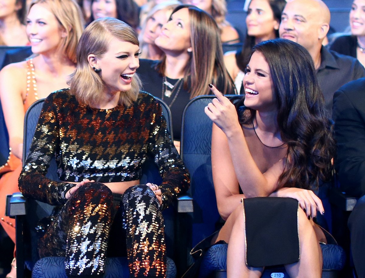 Taylor Swift and Selena Gomez laugh at the 2015 MTV VMAs