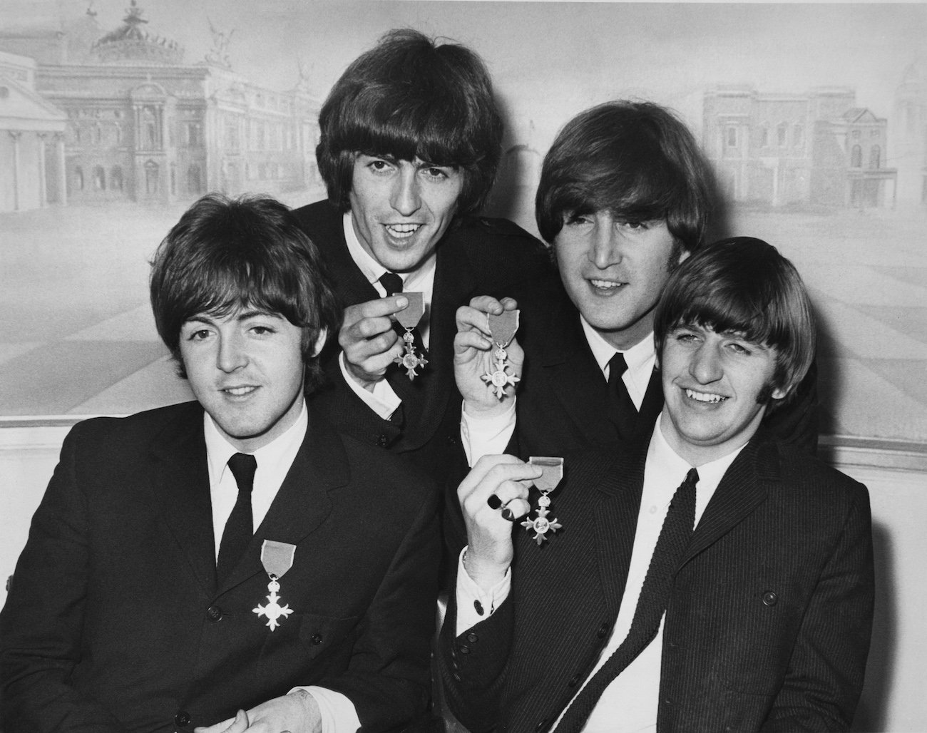 The Beatles holding their MBE awards, 1965.