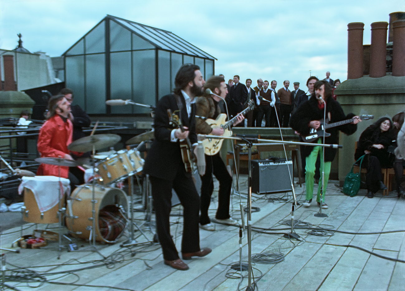The Beatles performing on the rooftop of Apple headquarters, 1969.