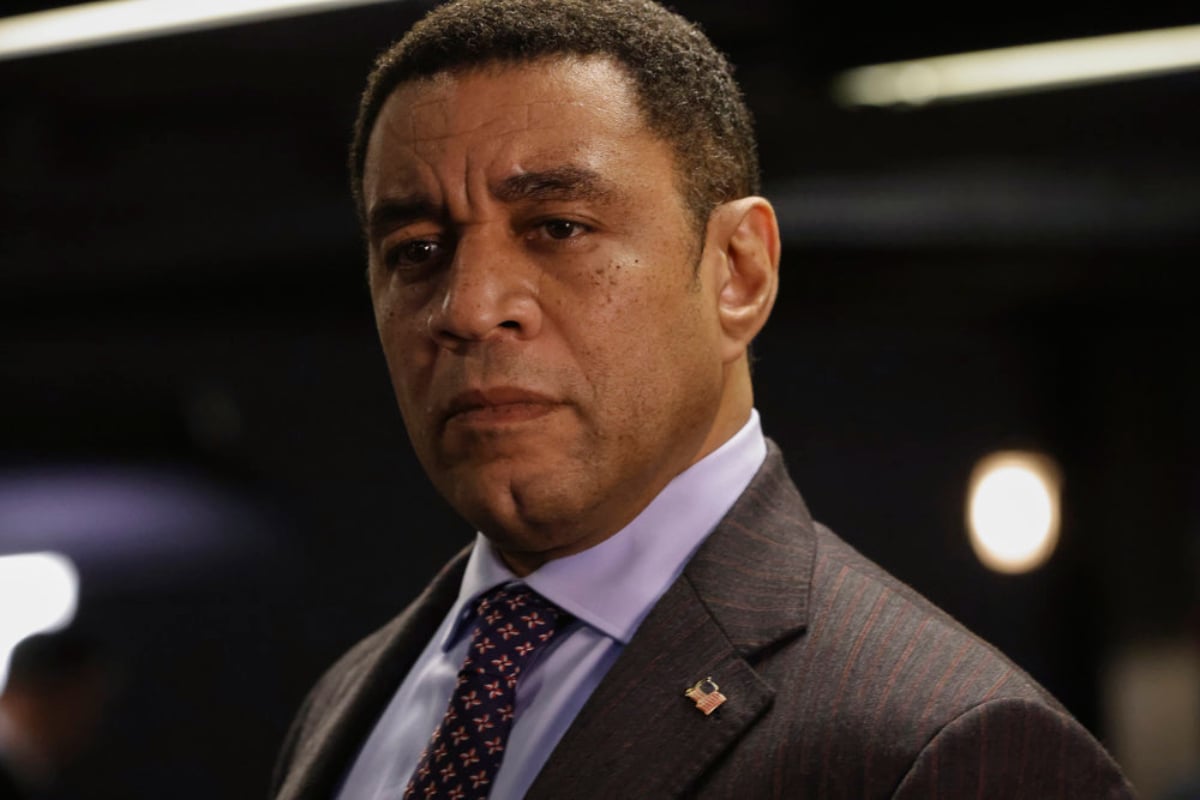 Harry Lennix as Harold Cooper in The Blacklist Season 9. Cooper is wearing a suit and tie.