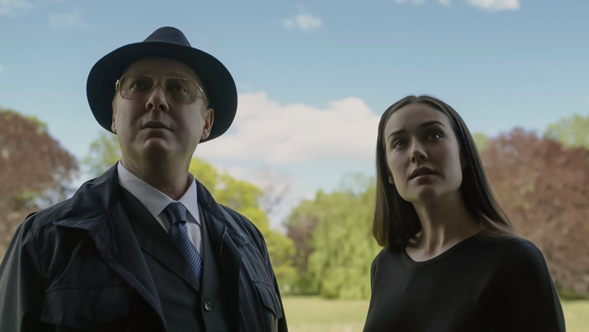 The Blacklist Season 9 will continue with Liz Keen. Red and Liz look at something, and there are trees and a blue sky in the background.
