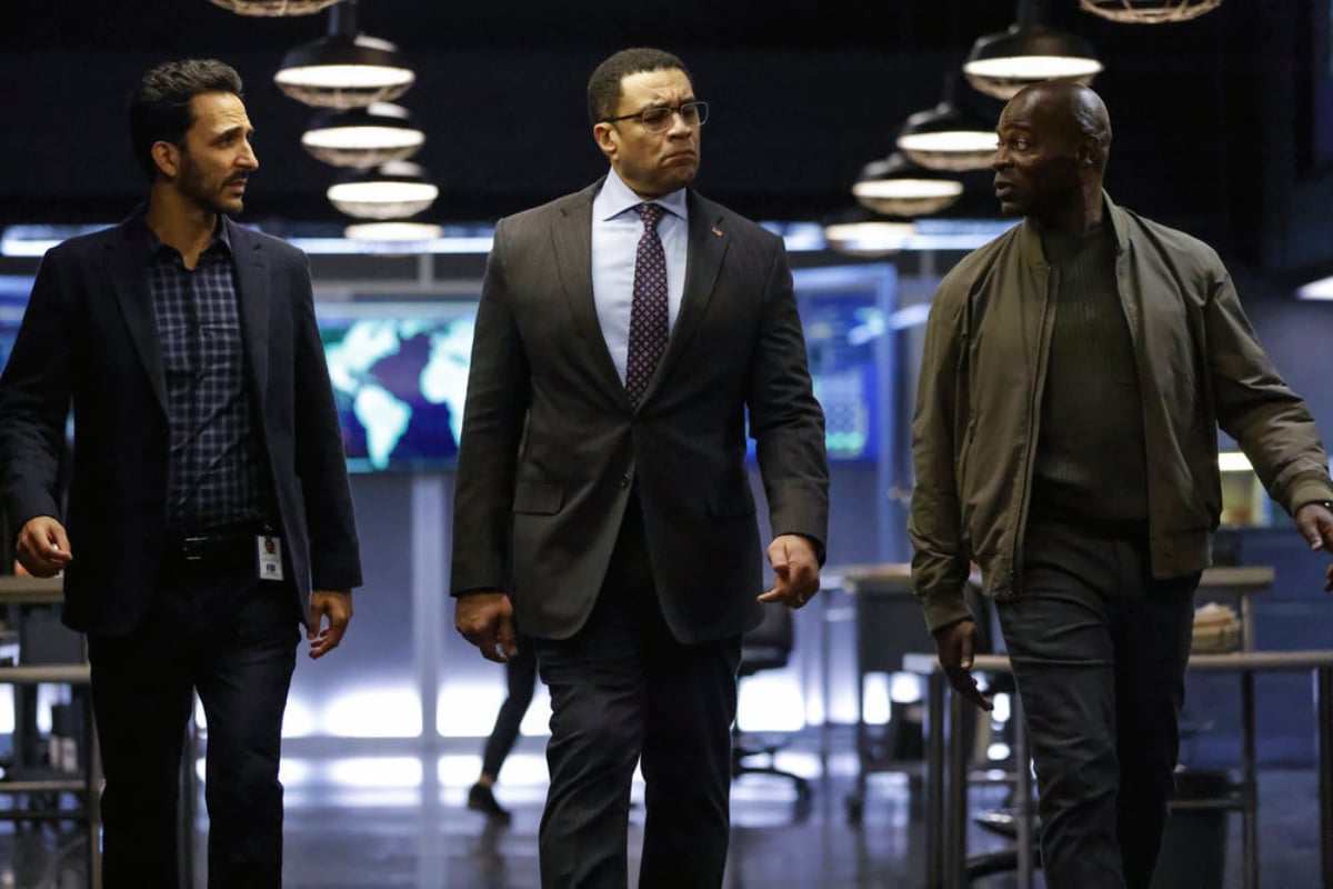 Amir Arison as Aram Mojtabai, Harry Lennix as Harold Cooper, Hisham Tawfiq as Dembe Zuma walking next to each other in The Blacklist Season 9.