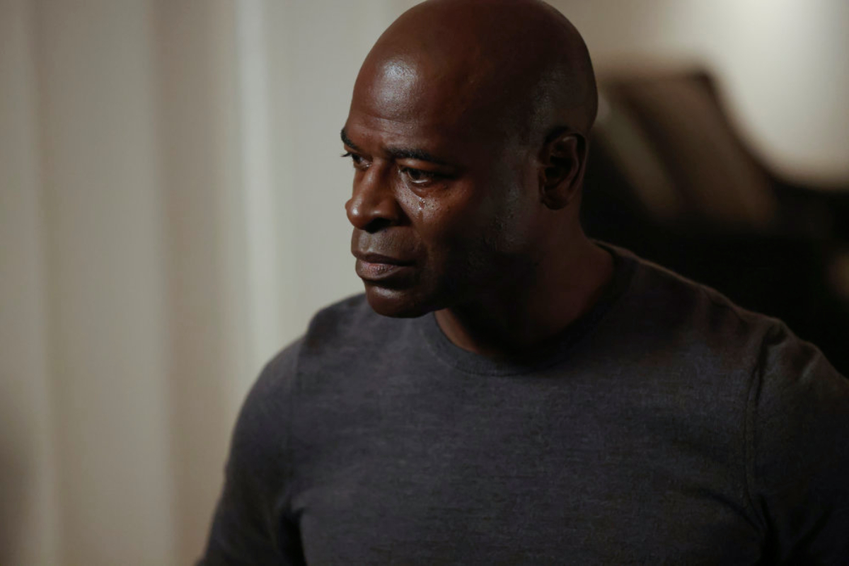 Hisham Tawfiq as Dembe Zuma in The Blacklist Season 9 Episode 5. A tear falls down Dembe's cheek.