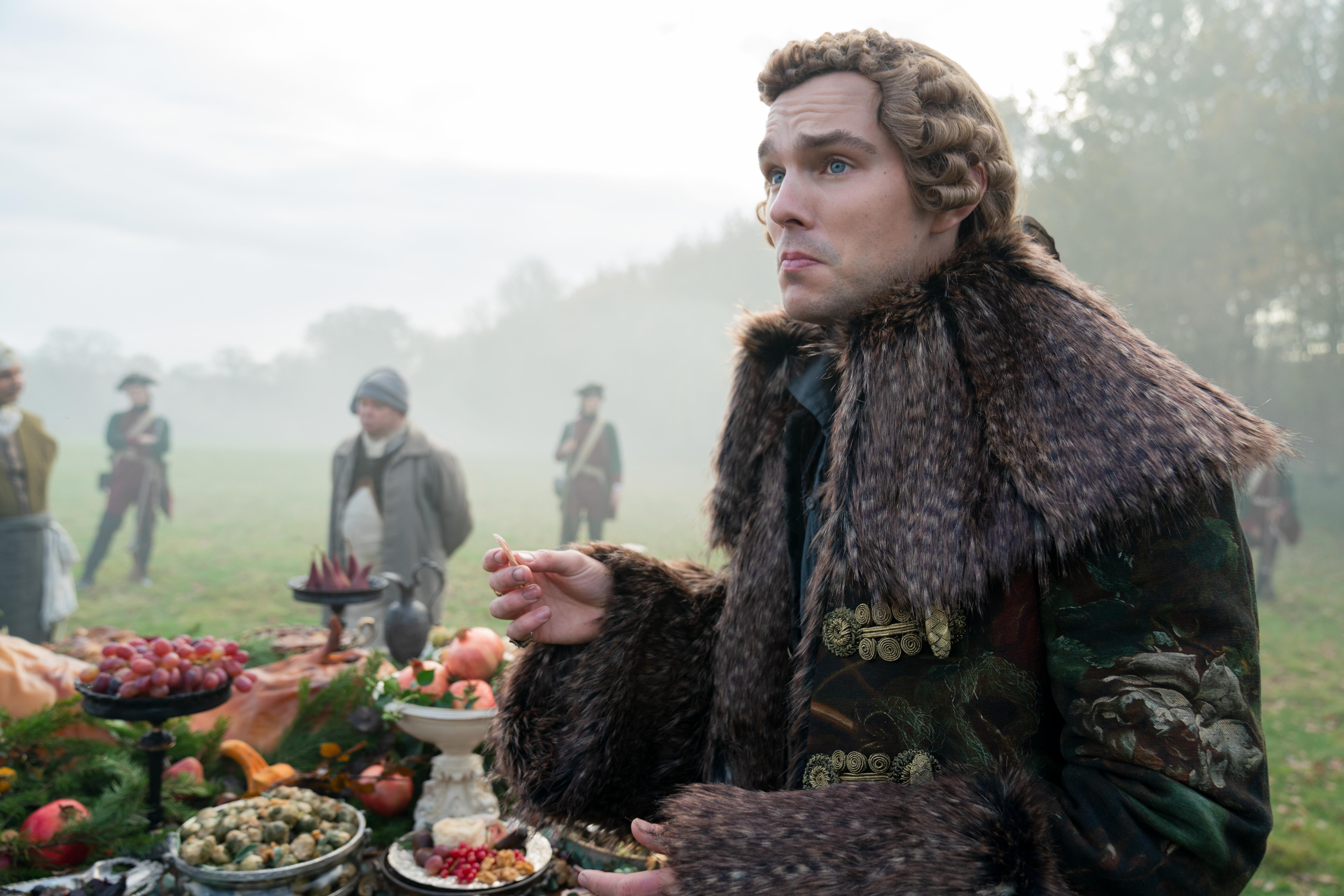 Nicholas Hoult as Peter, eating outside, in 'The Great' Season 2