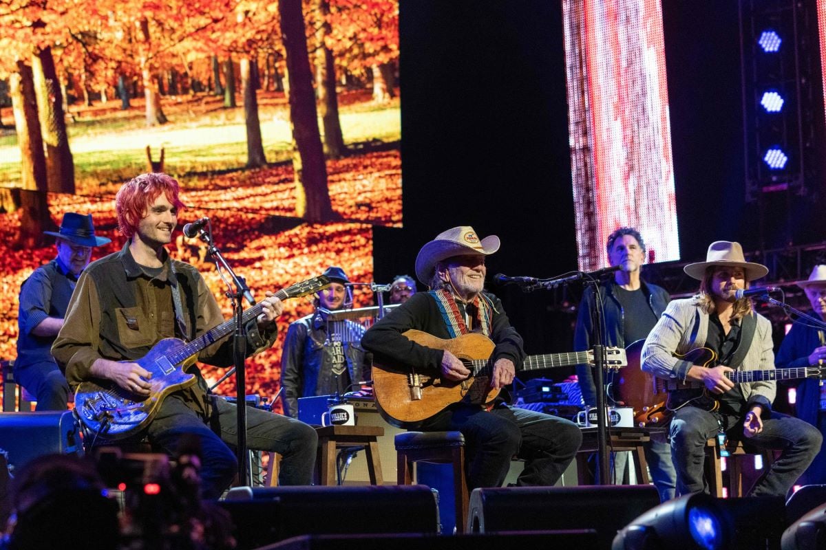 Micah Nelson, Willie Nelson, and Lukas Nelson perform during the Farm Aid 2021 music festival