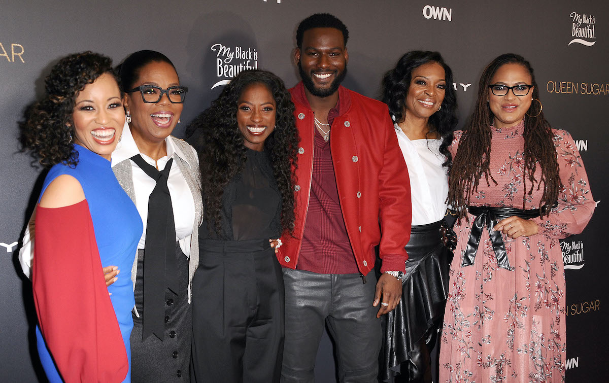 The cast of the OWN series 'Queen Sugar' poses together for a photo at an event for the show