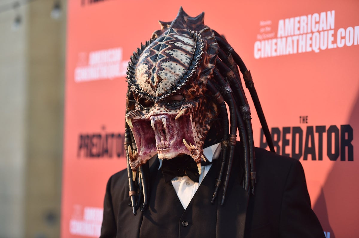 The Predator movie monster wearing a tuxedo