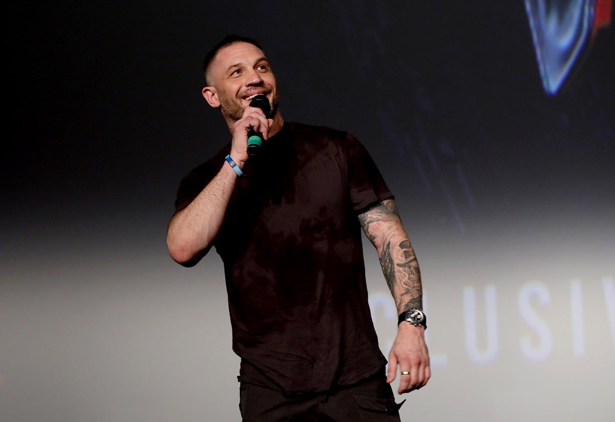 Tom Hardy speaking into a microphone