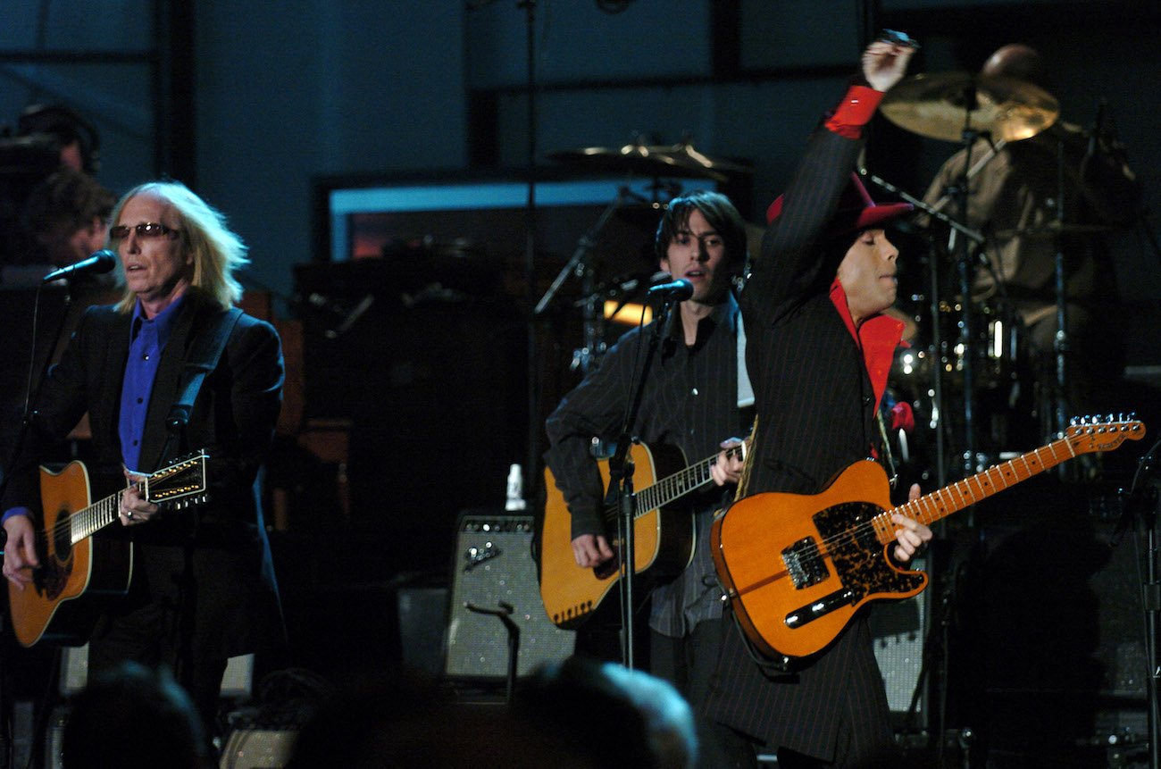 Tom Petty, Dhani Harrison, and Prince performing during George Harrison's Rock & Roll Hall of Fame induction.