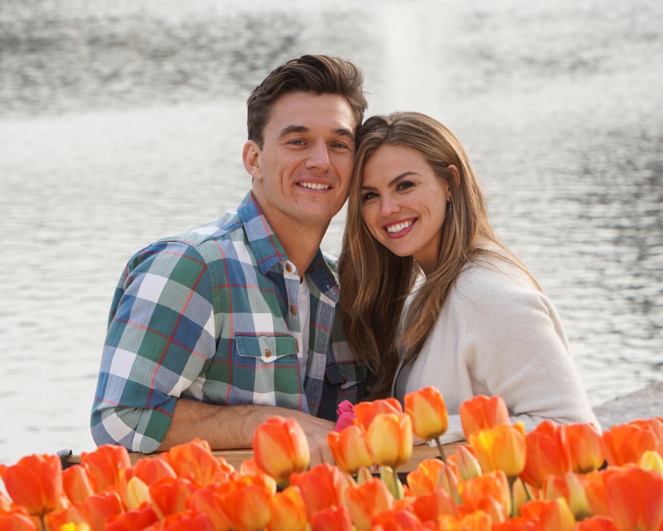 Tyler Cameron and Hannah Brown sit above flowers on 'The Bachelorette'
