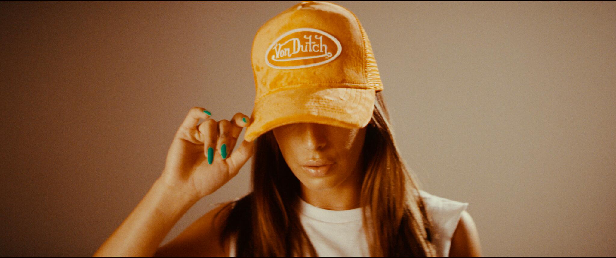 Girl wearing a Von Dutch trucker hat