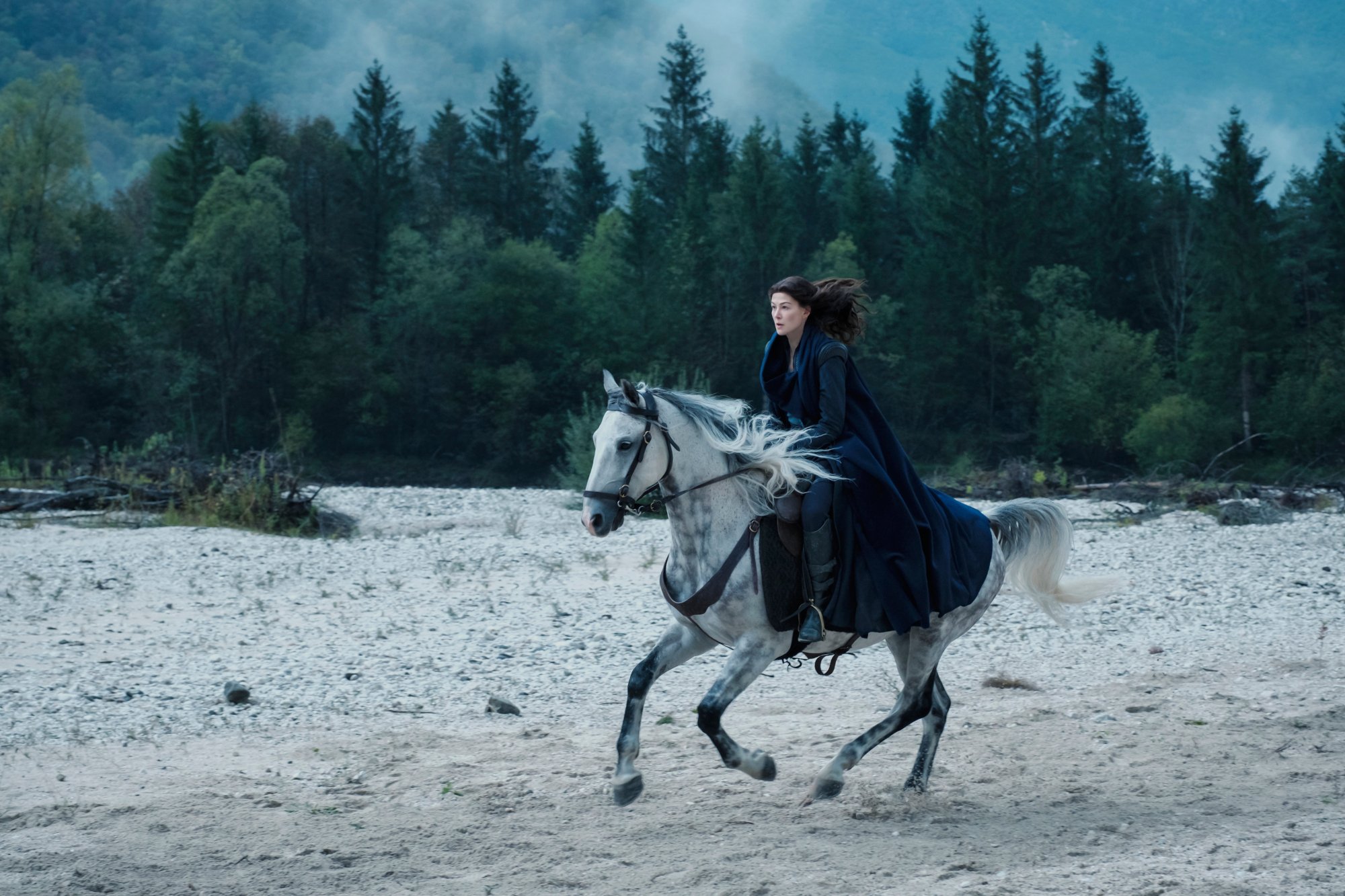 Rosamund Pike as Moiraine Damodred in Amazon Prime Video's 'The Wheel of Time.' She's riding on horseback.