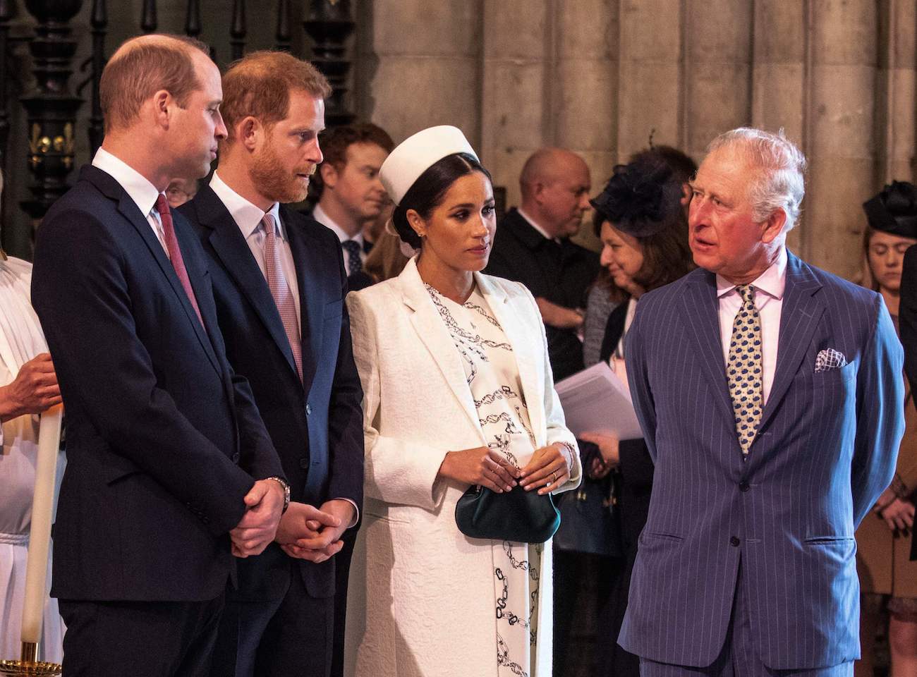 Prince William, Prince Harry, Meghan Markle, and Prince Charles talking to each other