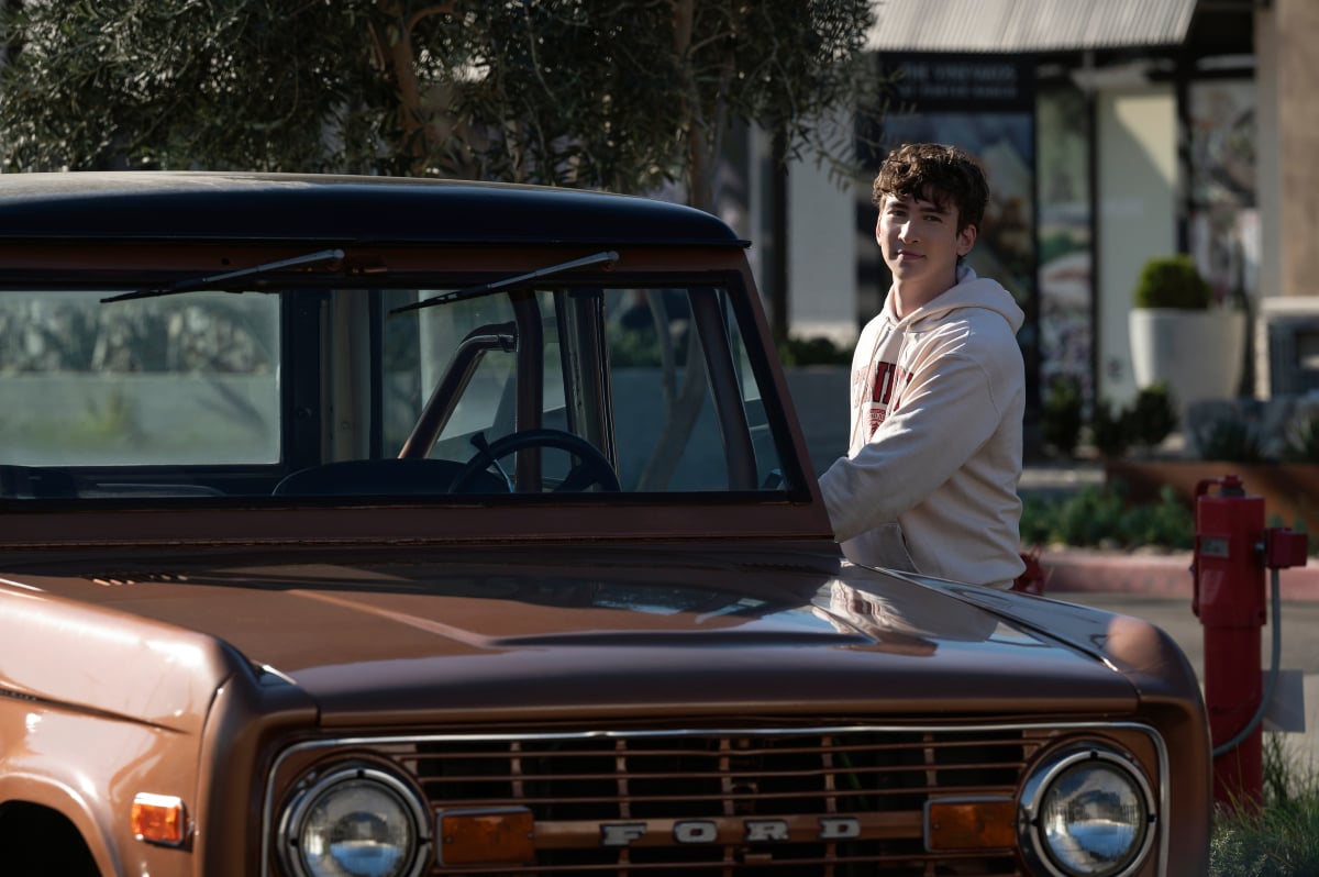 You Season 3 Dylan Arnold as Theo getting into a Ford truck.