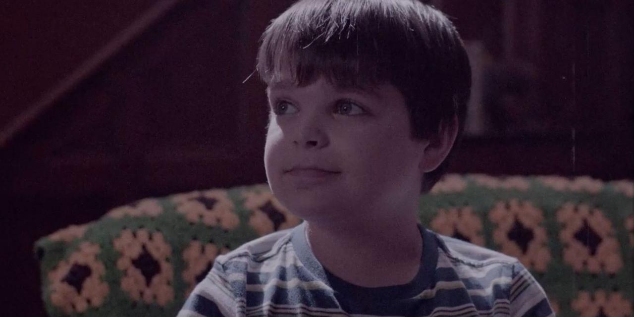 Young version of Eddie Caputo in 'Chucky' episode 4 of series wearing striped shirt.