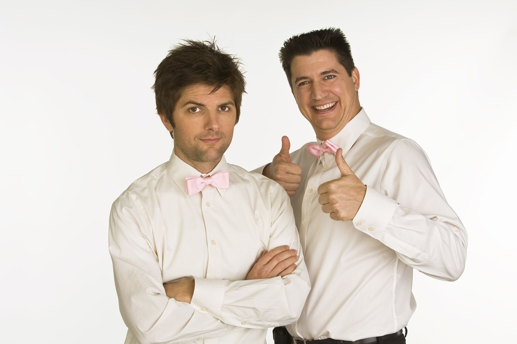 Adam Scott and Ken Marino of 'Party Down' wearing white shirts and pink bow ties