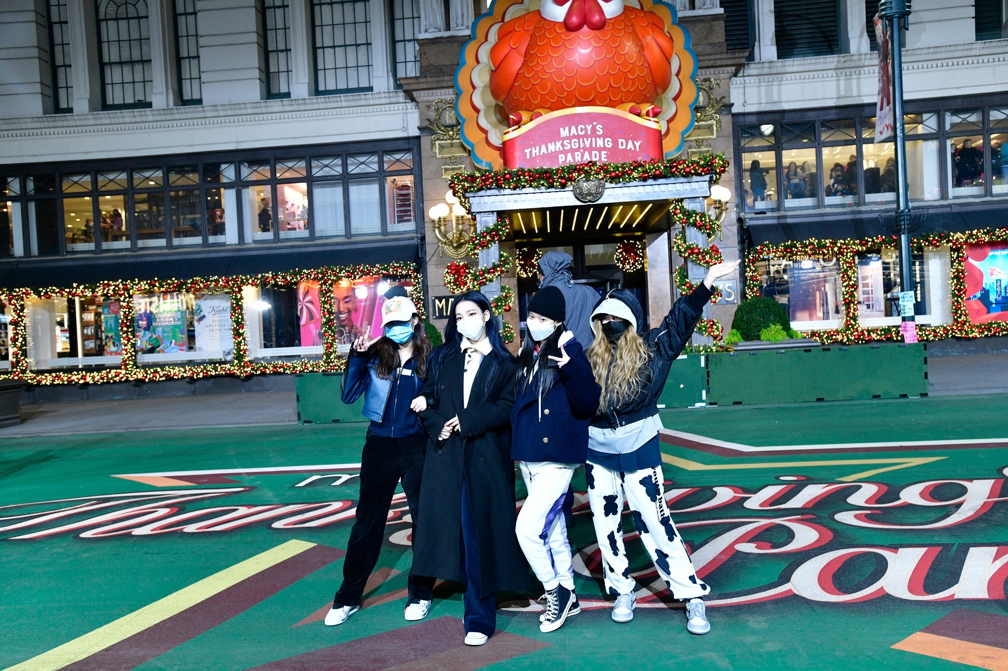 The members of aespa pose during rehearsal for the 95th Annual Macy's Thanksgiving Day Parade®
