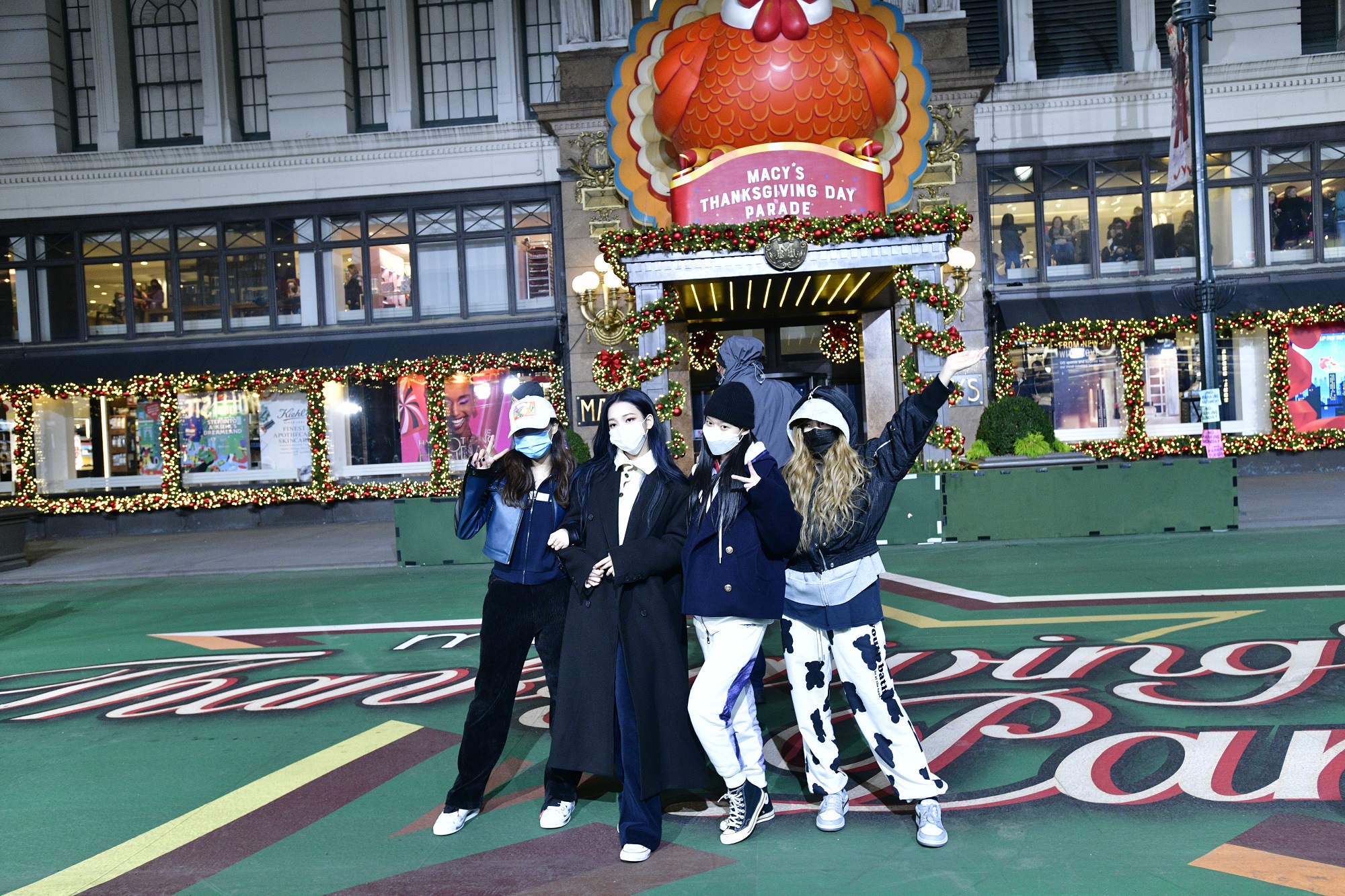 The members of aespa pose during rehearsal for the 95th Annual Macy's Thanksgiving Day Parade®