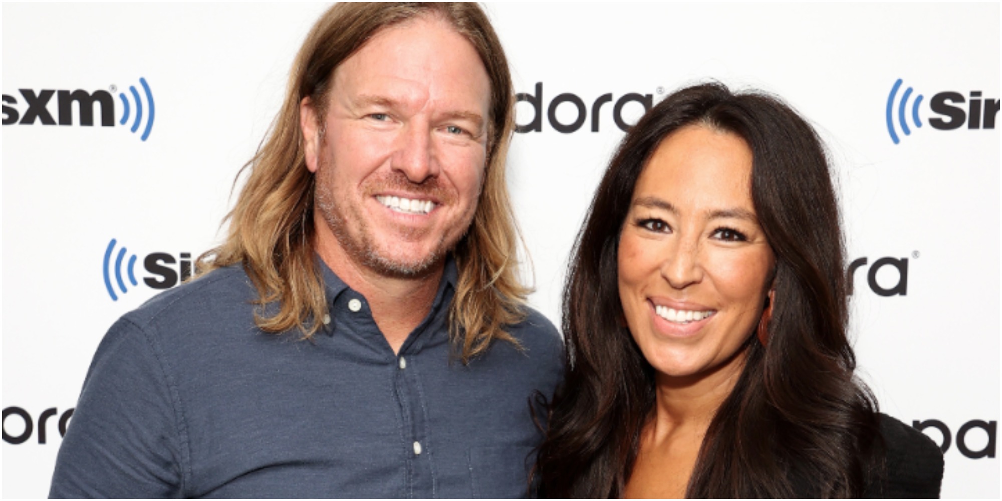 Chip and Joanna Gaines sit together for a photograph.