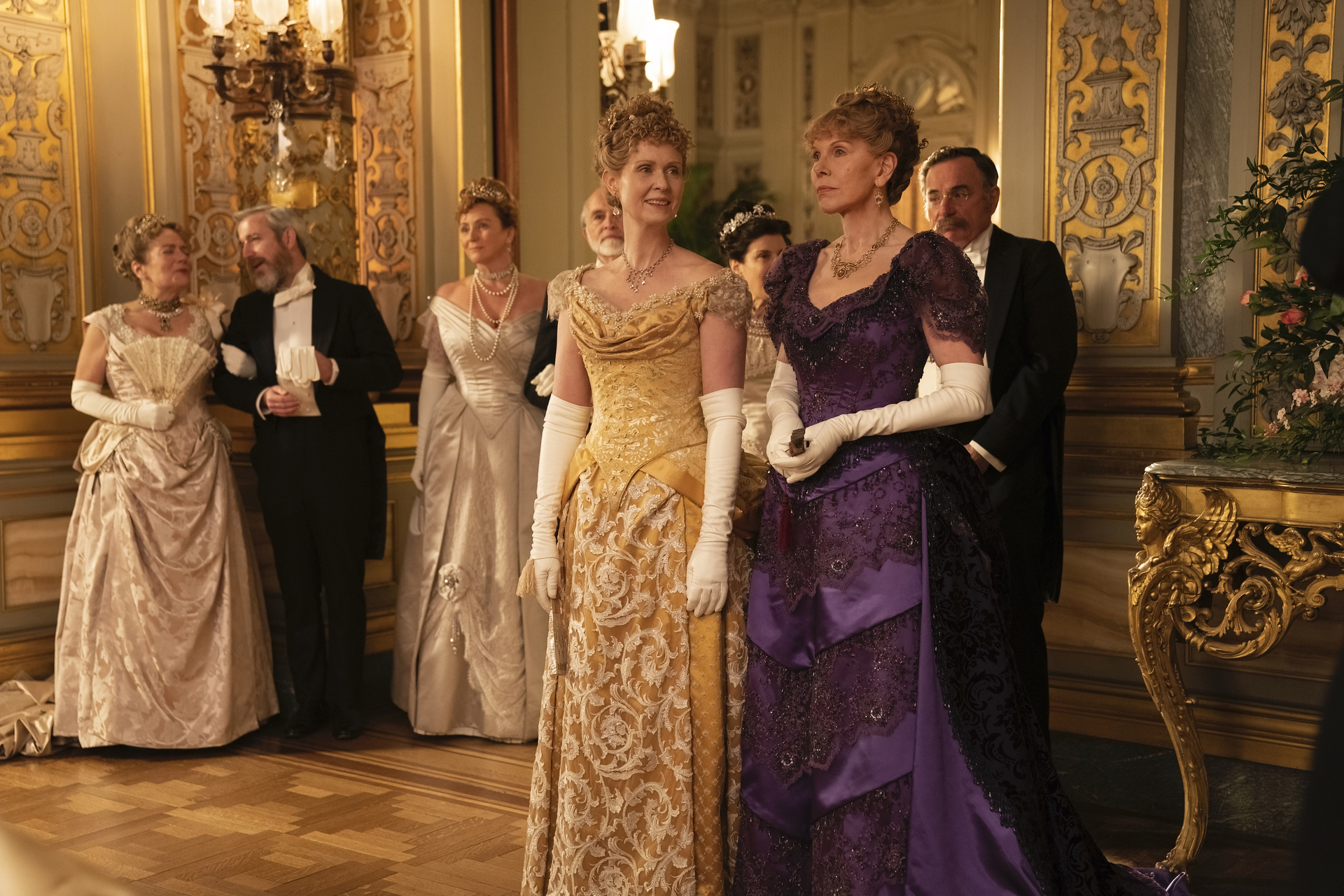 Cynthia Nixon and Christine Baranski standing in a ballroom in 'The Gilded Age'