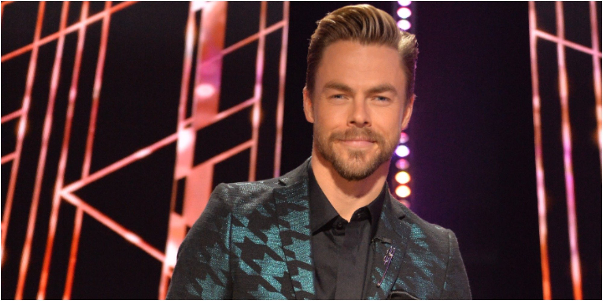 Derek Hough is seated on the set of "Dancing with the Stars."