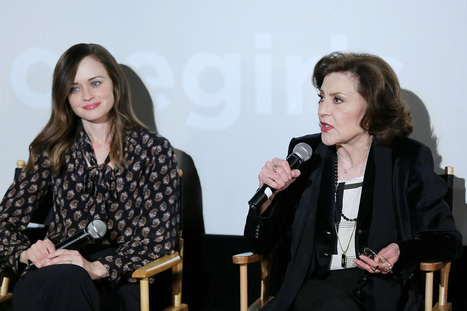 Gilmore Girls stars Alexis Bledel and Kelly Bishop each hold a mic at the Gilmore Girls: A Year in the Life event