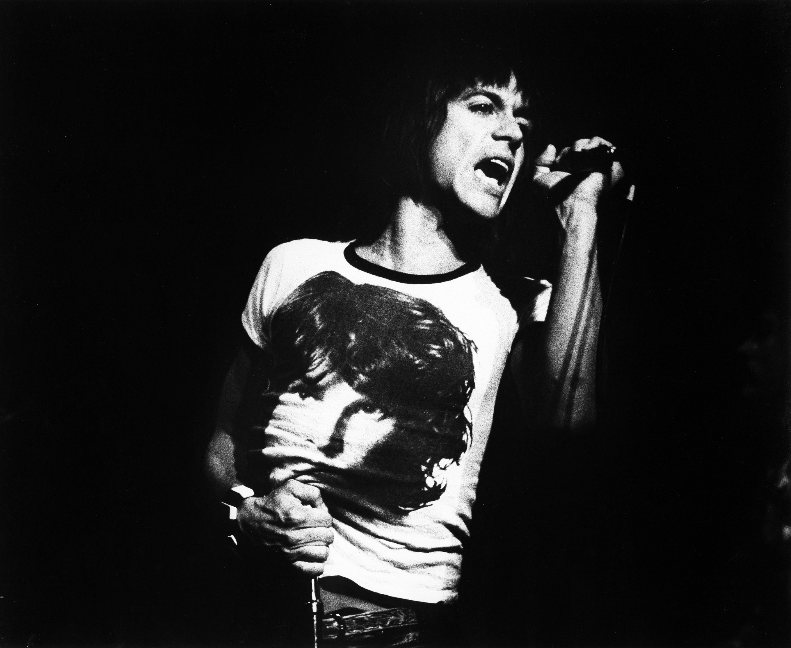 Iggy Pop wearing a shirt depicting The Doors' Jim Morrison