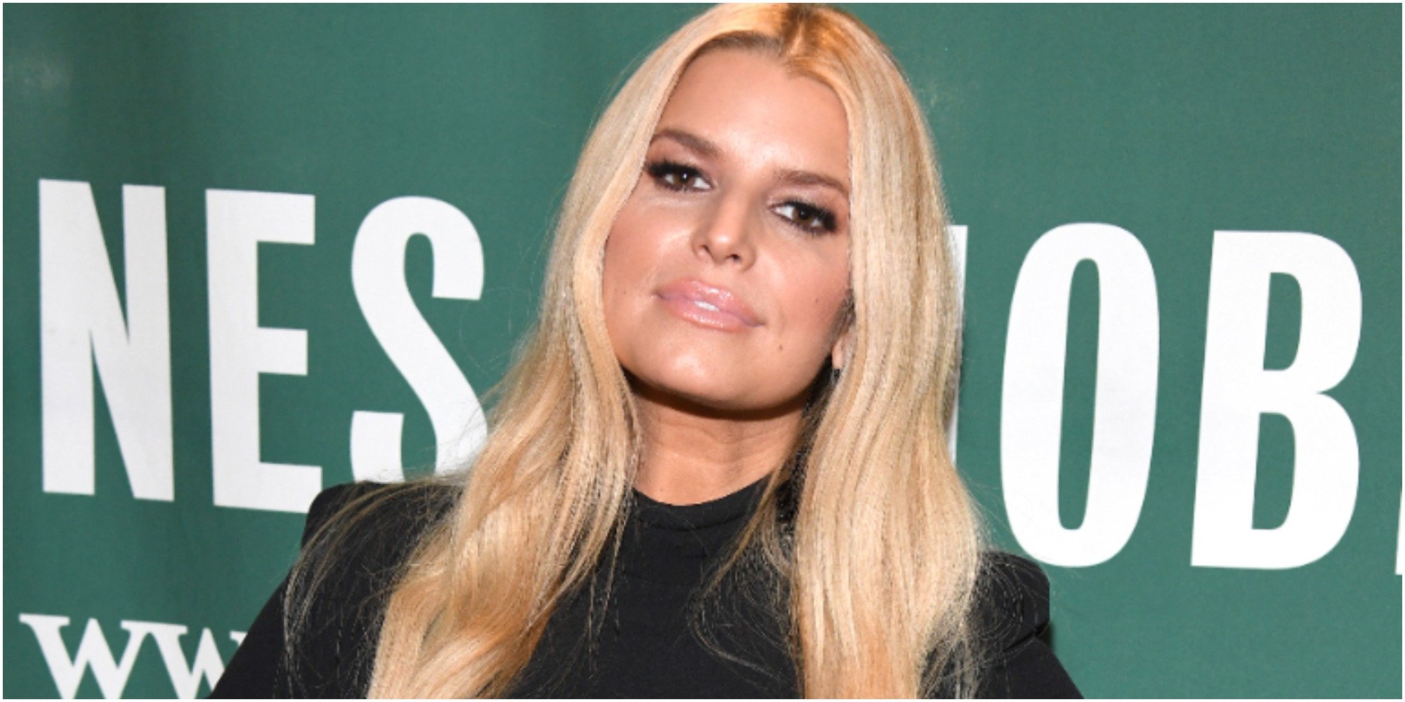 Jessica Simpson poses in a black dress during a 2020 book signing.