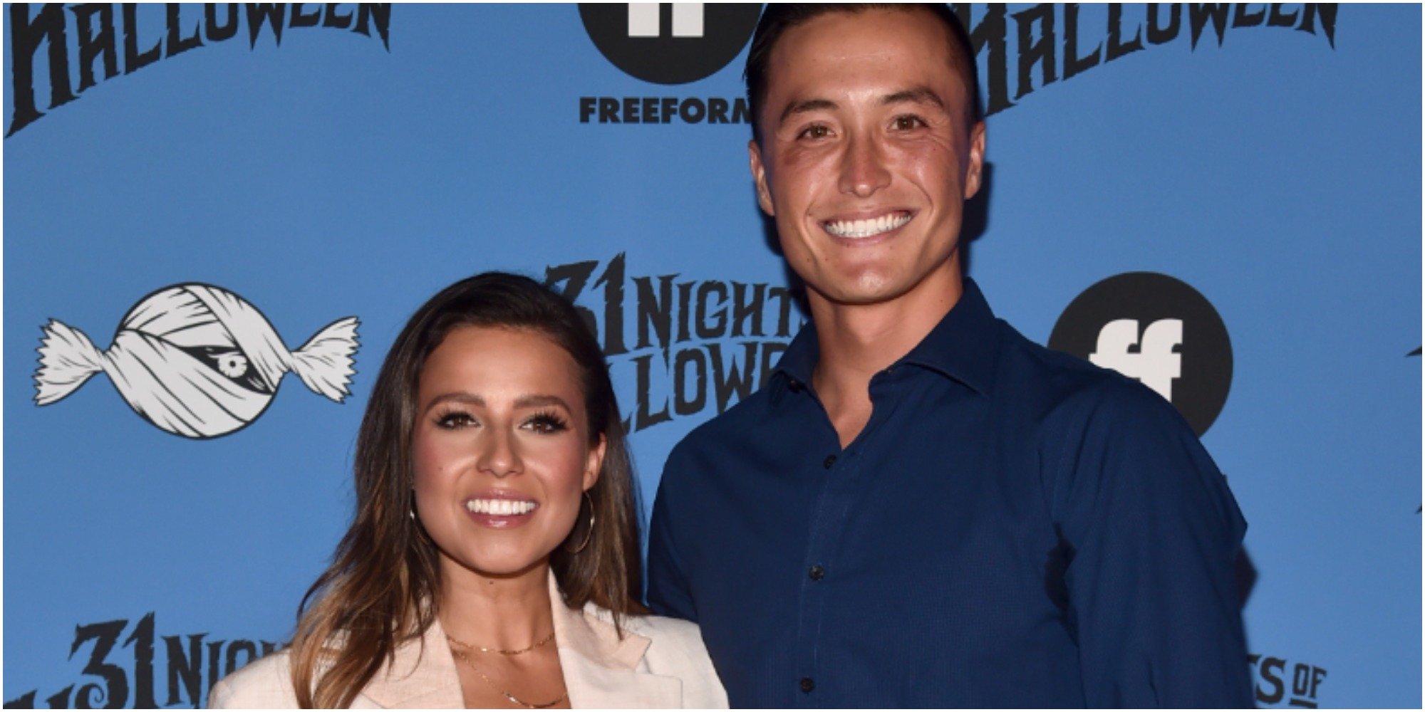 John Hersey and Katie Thurston pose together at a red carpet event.