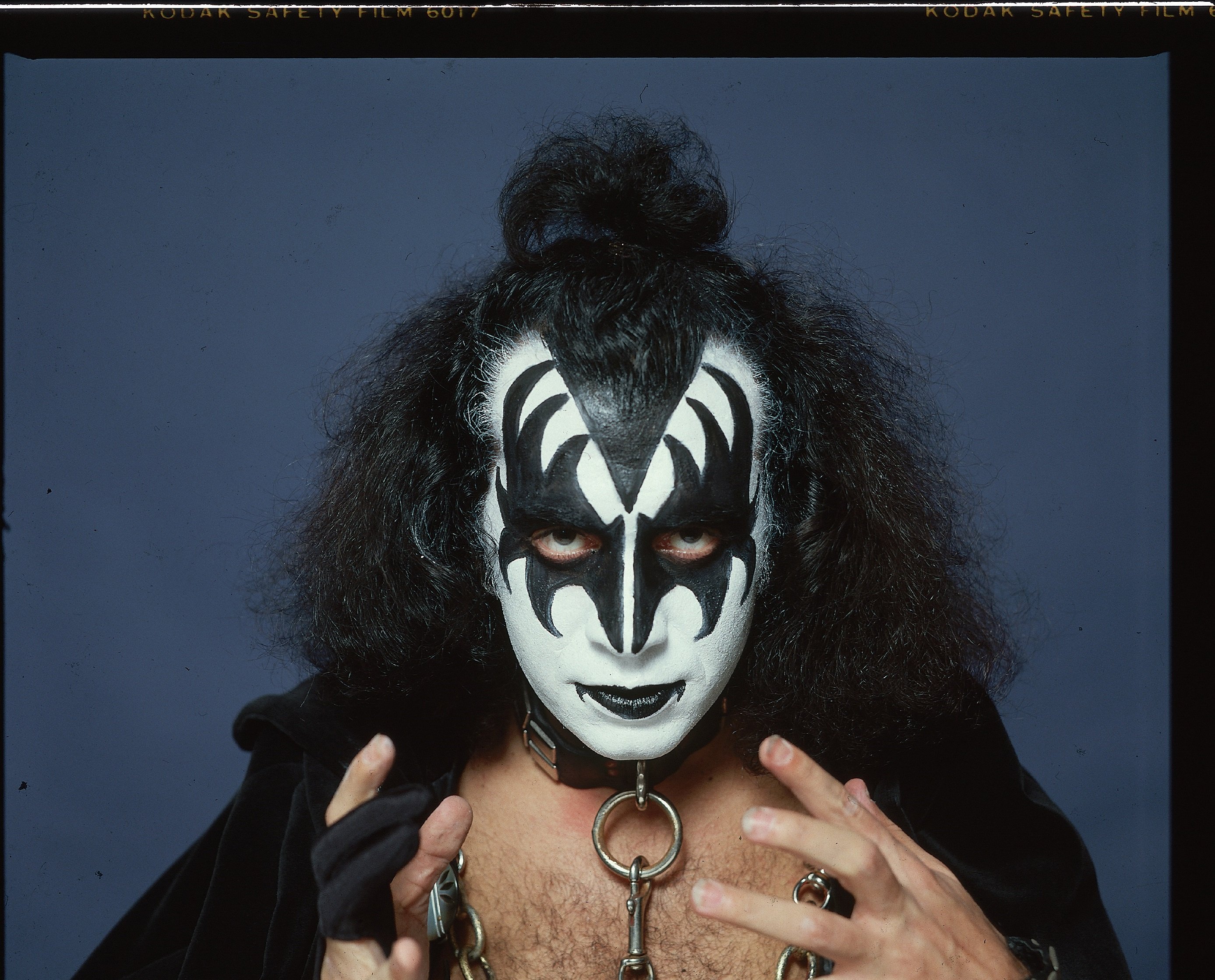Kiss' Gene Simmons with a blue background