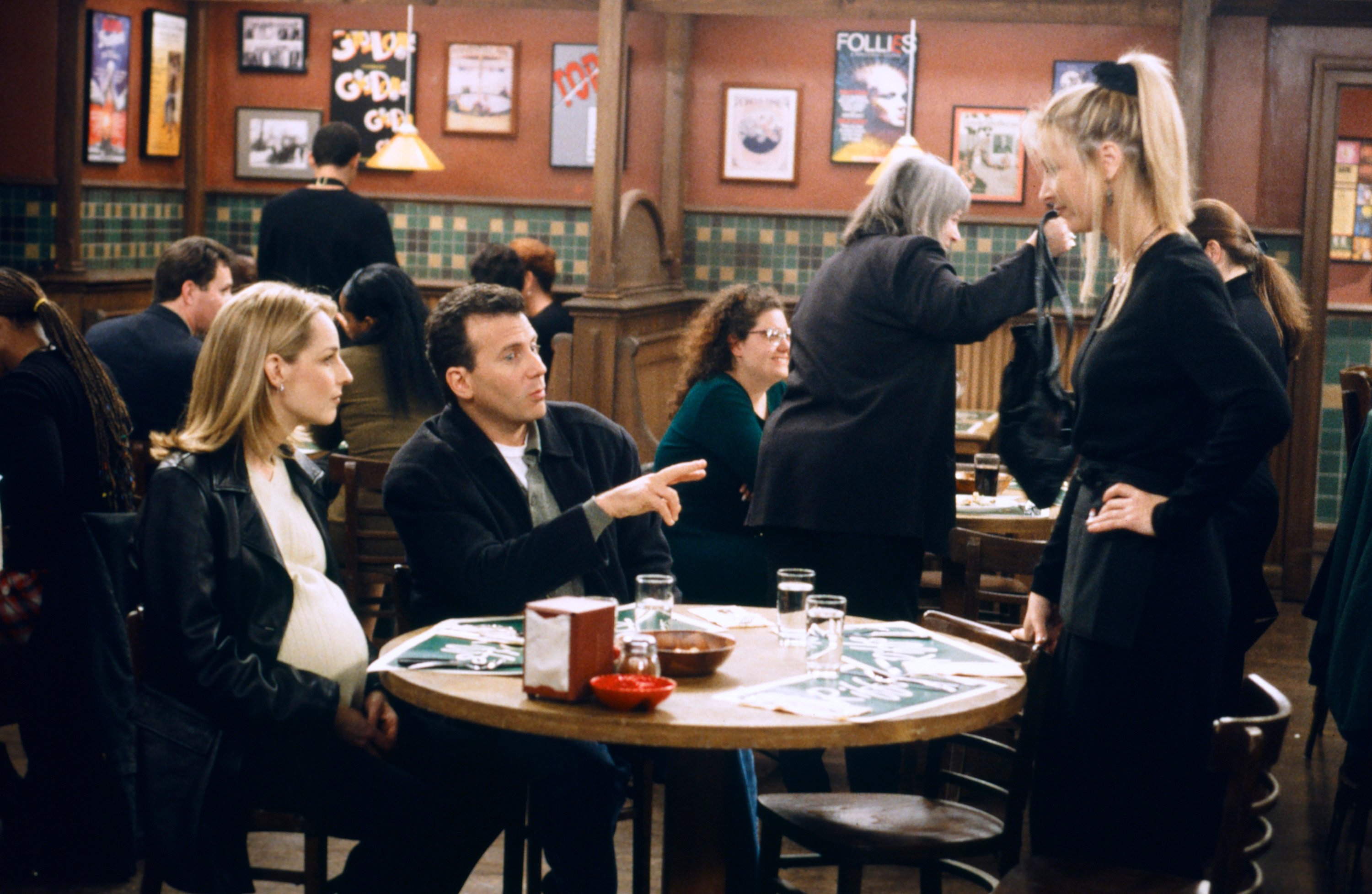 Helen Hunt as Jamie Stemple Buchman, Paul Reiser as Paul Buchman, and Lisa Kudrow as Ursula Buffay are seen in Riff's during an episode of 'Mad About You'