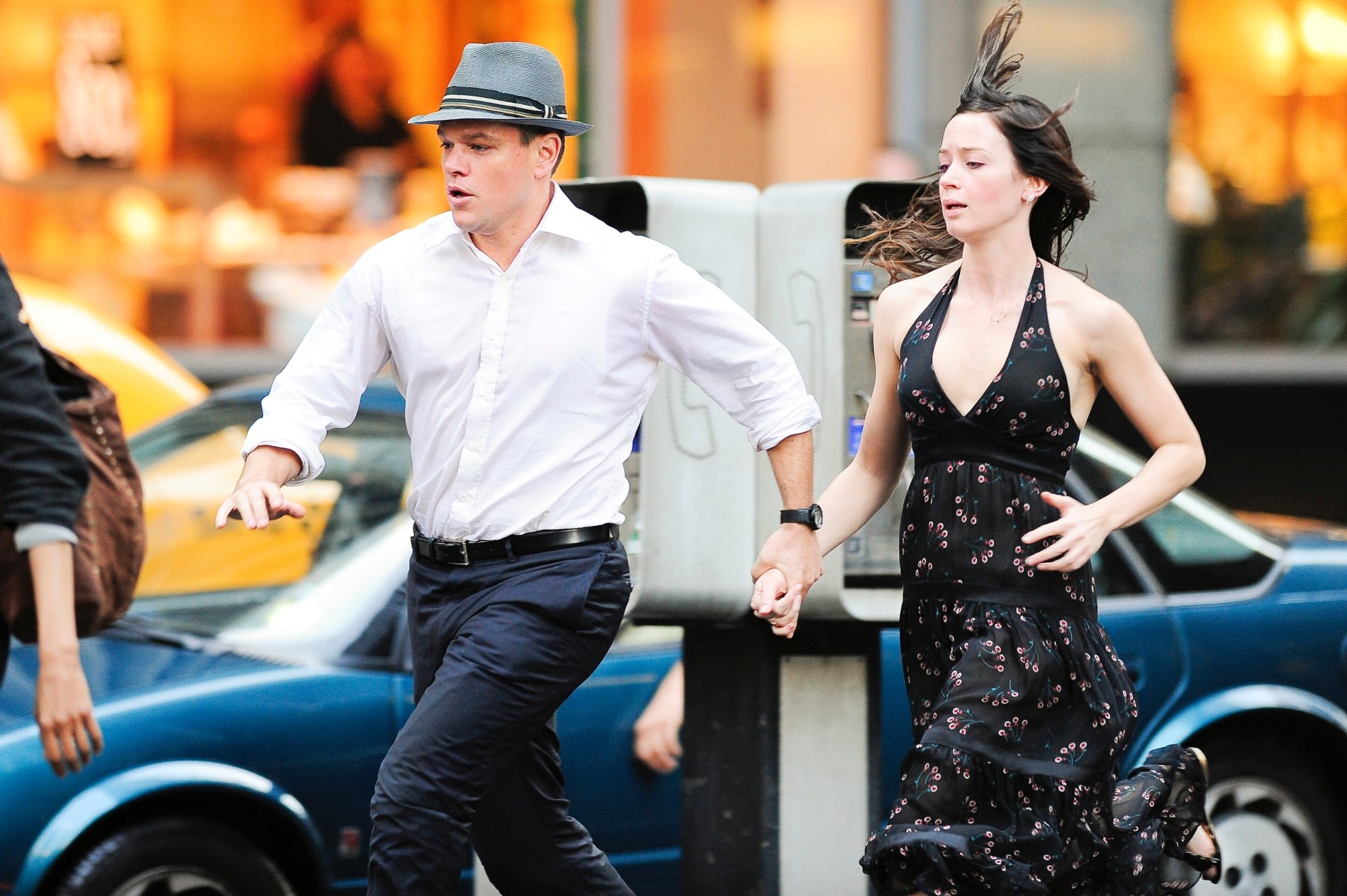 Matt Damon and Emily Blunt running down the street on set of 'The Adjustment Bureau'