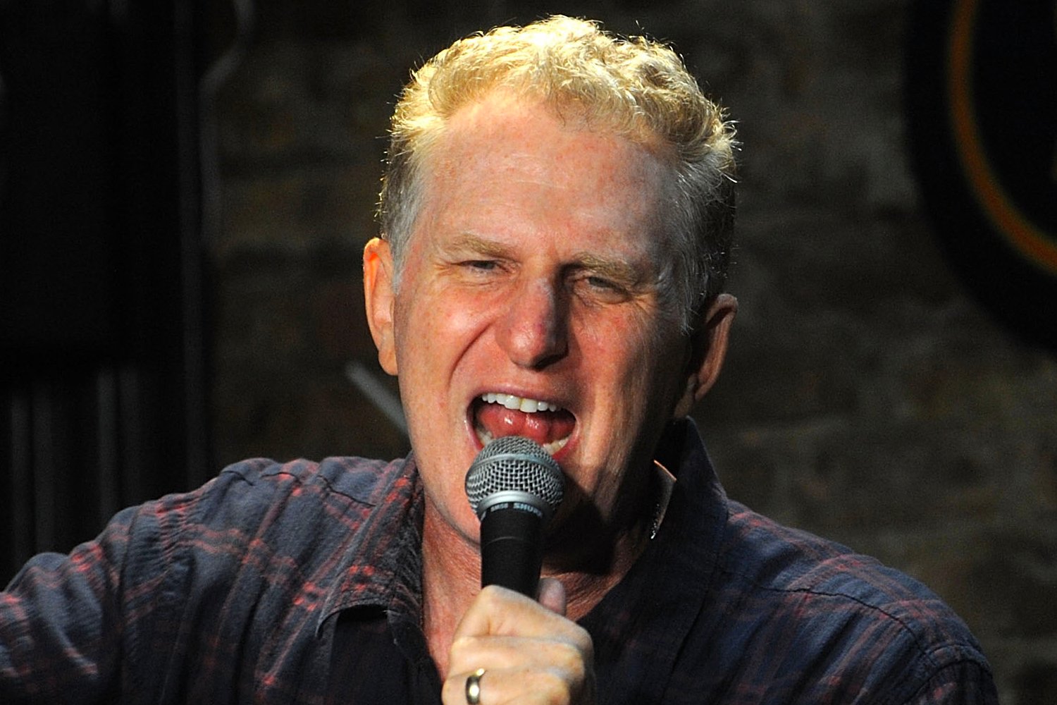 Michael Rapaport yelling into a micrphone