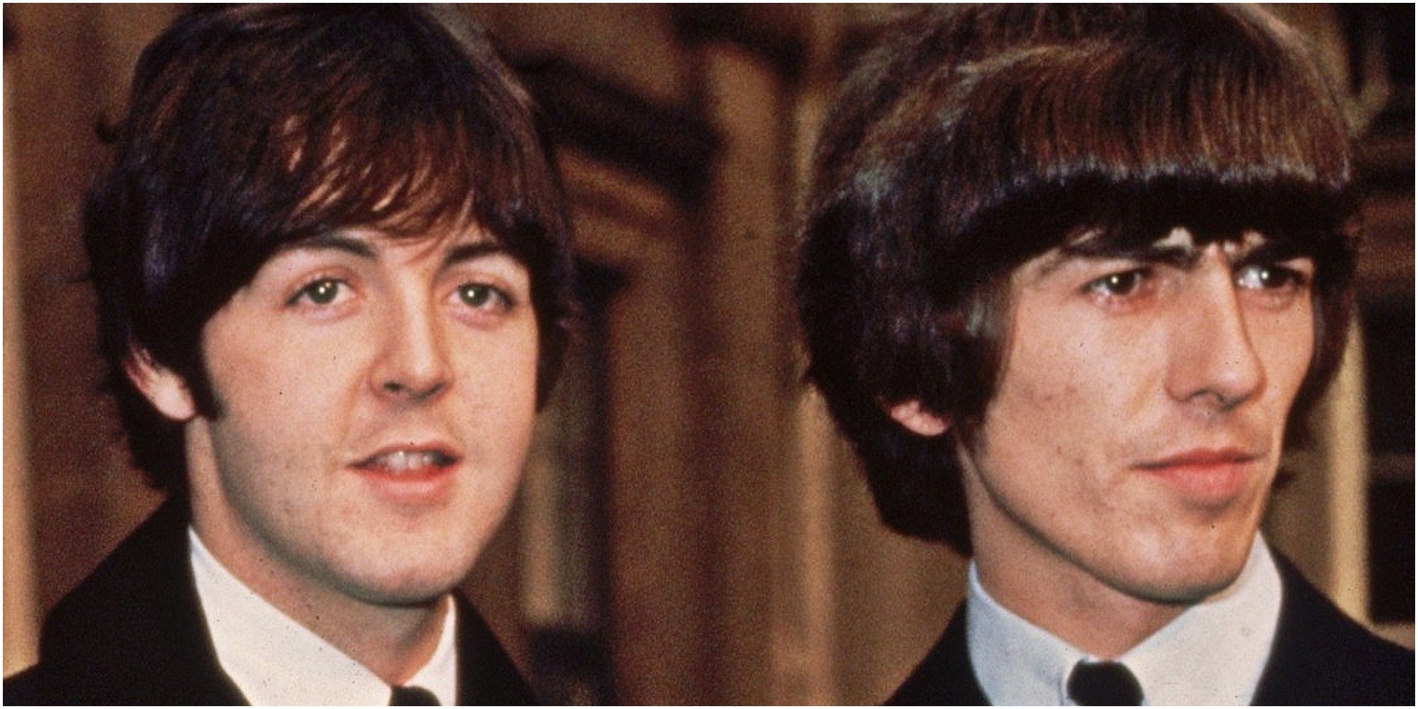 Paul McCartney and George Harrison receive their MBE Awards.