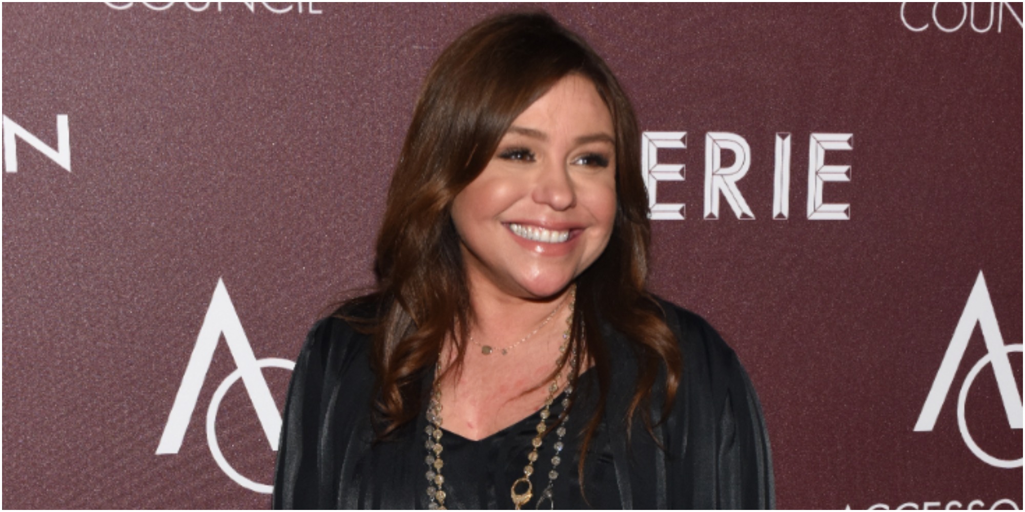 Rachael Ray poses on the red carpet at a celebrity event.