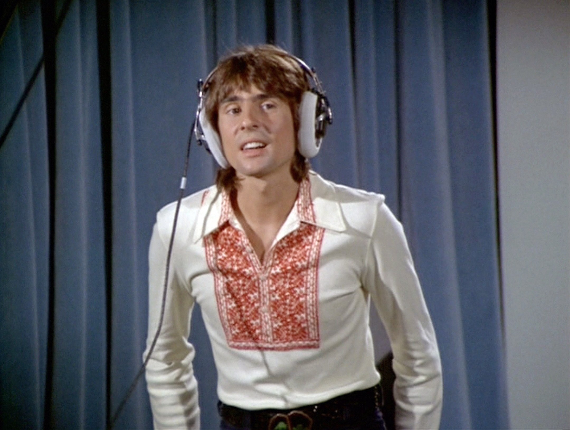 The Monkees' Davy Jones on 'The Brady Bunch' in front of a curtain