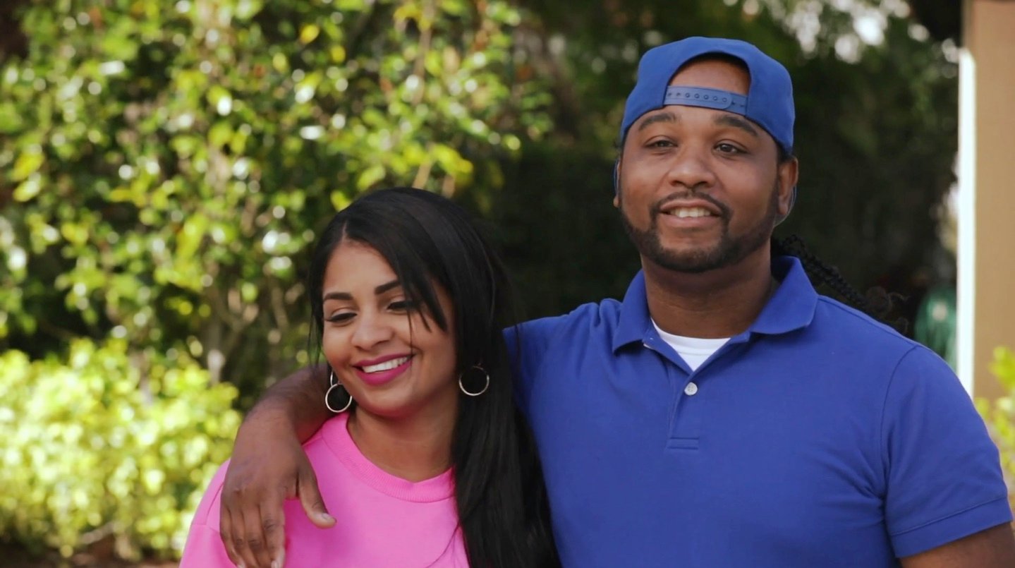 '90 Day Fiancé' stars Robert and Anny seen here with Anny wearing a pink shirt and Robert wearing a blue Polo