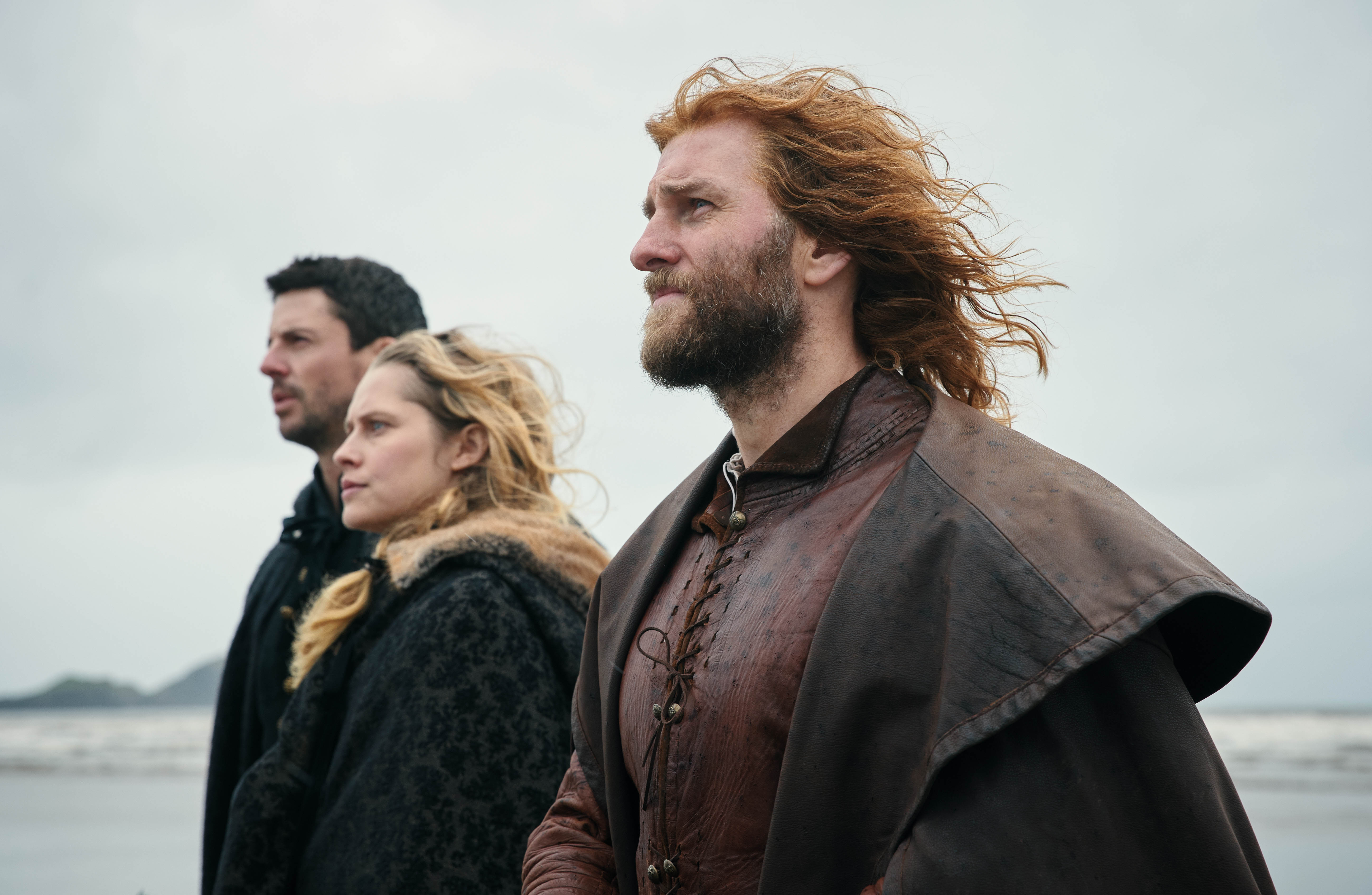 Gallowglass, Diana, and Matthew in profile with ocean in the background in 'A Discovery of Witches' Season 2