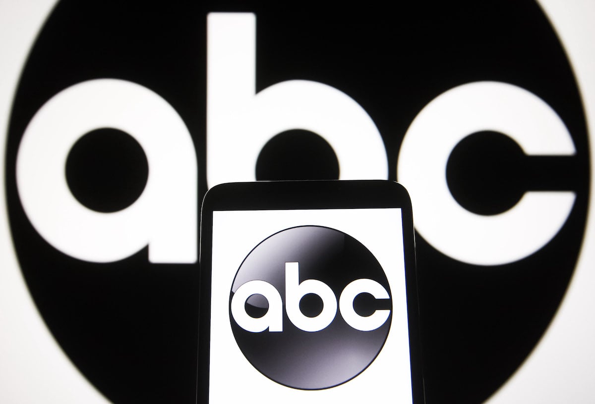The ABC network logo displayed on a smartphone screen and a computer screen