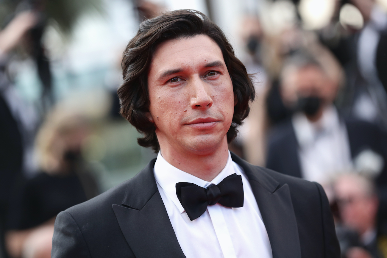 Adam Driver poses on the red carpet in Cannes
