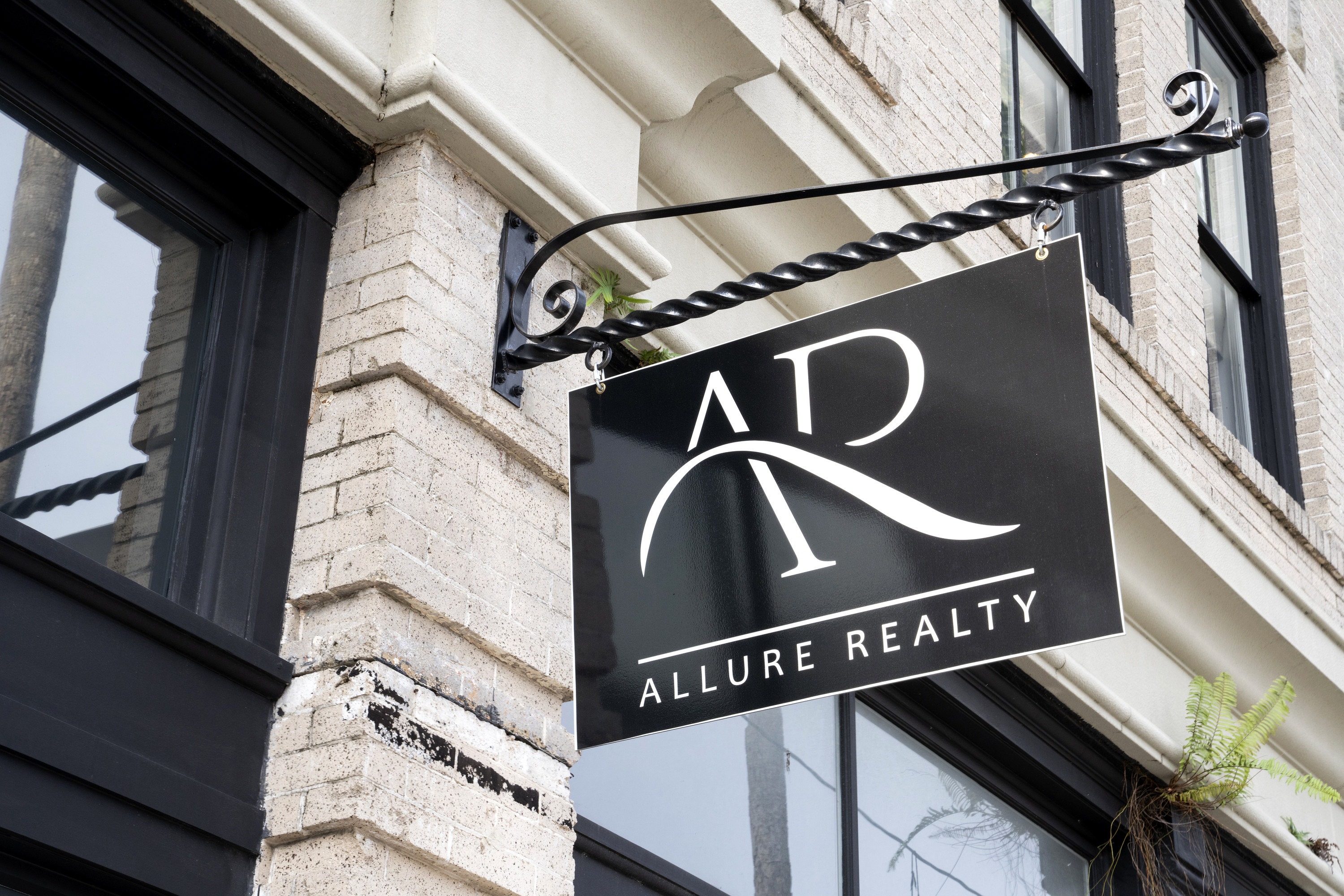 The sign outside Allure Realty, the real estate brokerage from Netflix's 'Selling Tampa'