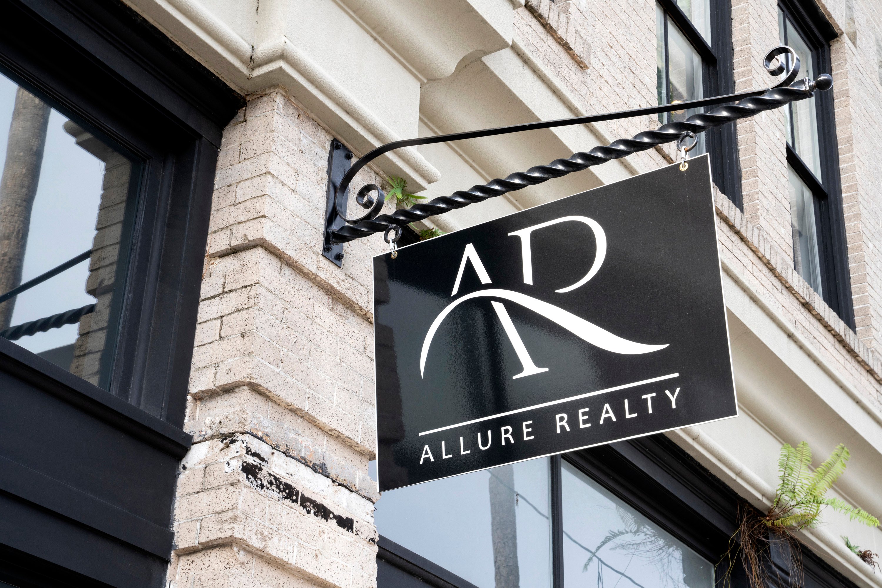 The sign outside Allure Realty, the real estate brokerage from Netflix's 'Selling Tampa'