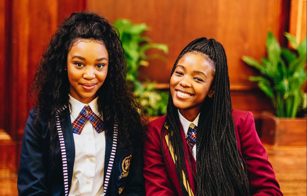 Ama Qamata and Khosi Ngema wearing the Parkhurst High uniforms in 'Blood & Water.'