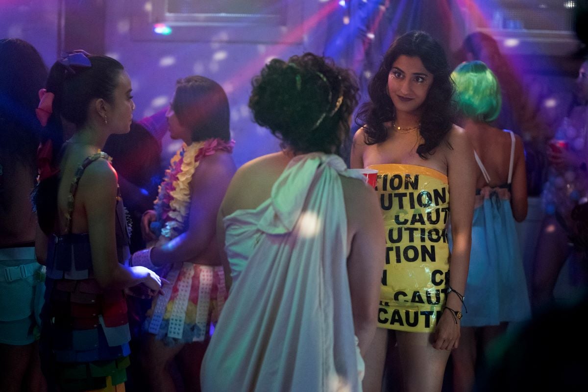 Amrit Kaur as Bela wearing a caution tape dress in 'The Sex Lives of College Girls'