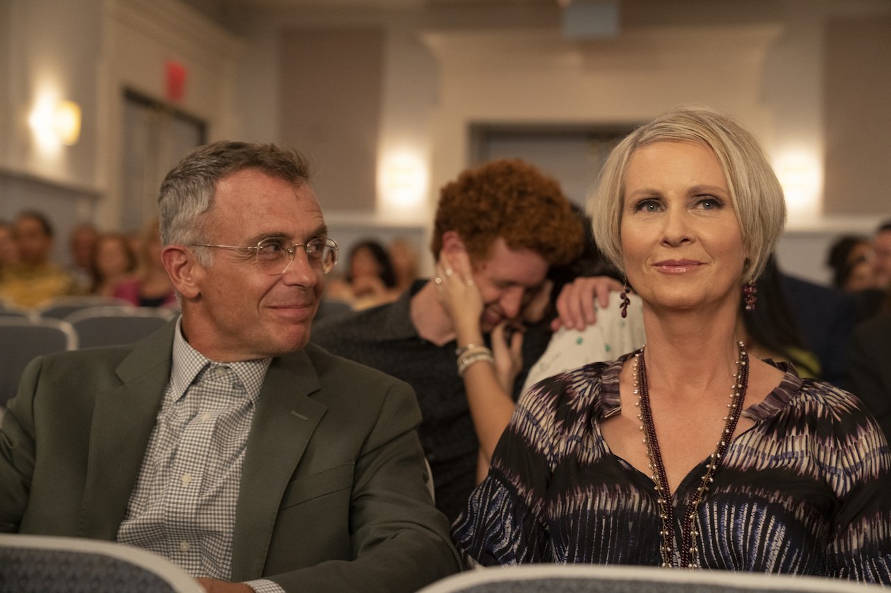 David Eigenberg as Steve Brady and Cynthia Nixon as Miranda Hobbes sit next to each other in a theater in 'And Just Like That...'