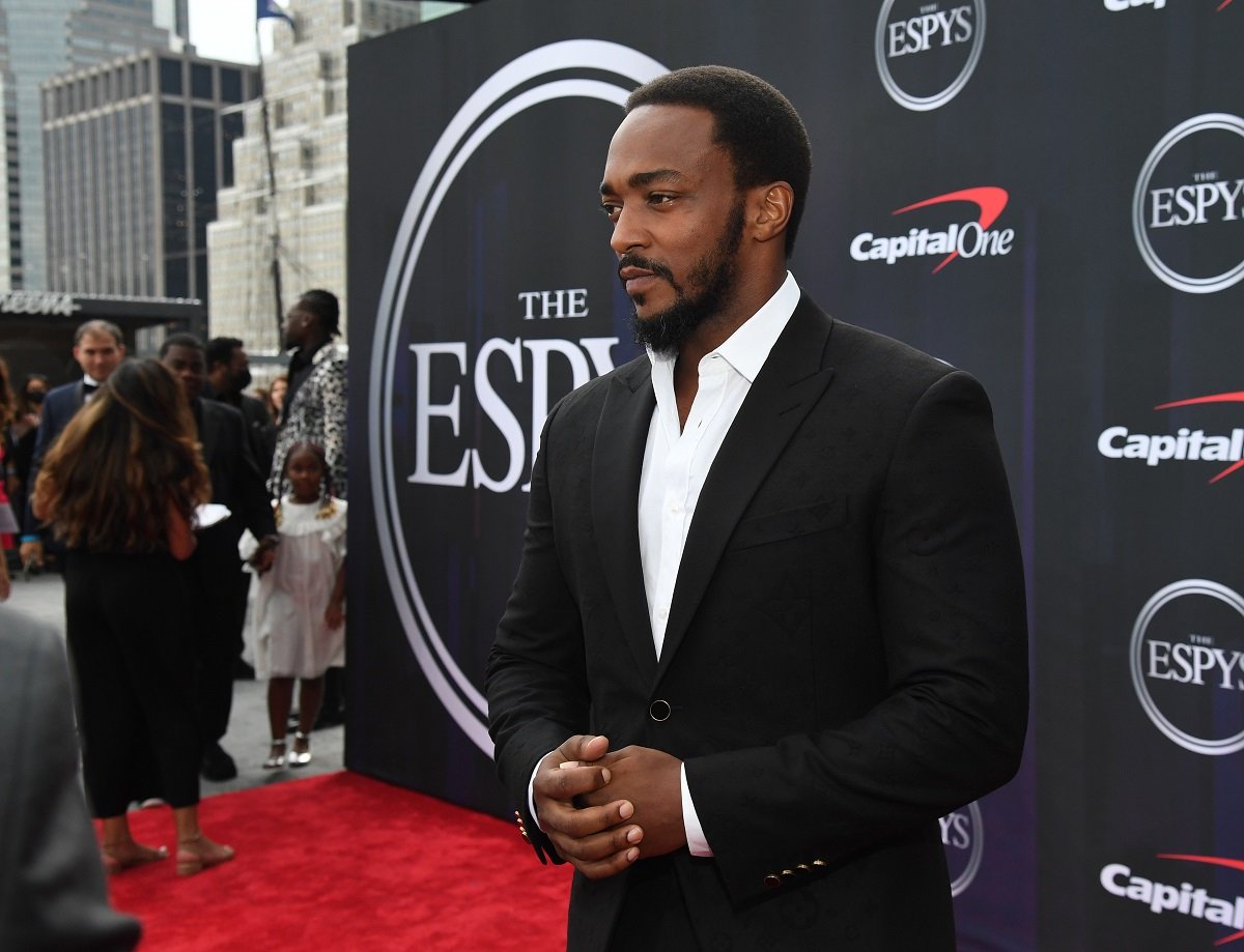 Anthony Mackie posing in a suit